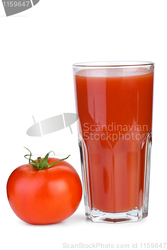 Image of Drinking glass with tomato juice and ripe fresh tomato near