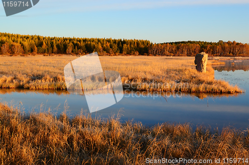 Image of Sunrise landscape of lake in grassland