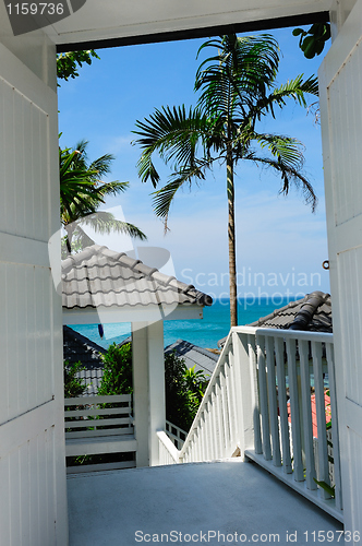 Image of Beach landscape through the door