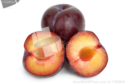 Image of Violet plums: whole and two halves