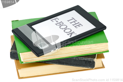 Image of Ebook reader and traditional paper books