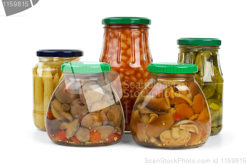 Image of Glass jars with marinated vegetables and mushrooms