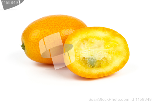 Image of Whole and sliced kumquat fruits