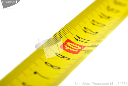 Image of Close-up shot of yellow metal measurement tape