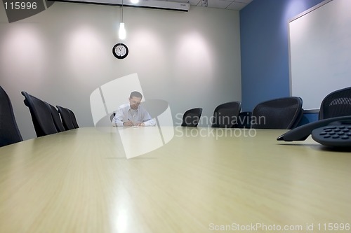 Image of Signing a Document in a Conference Room