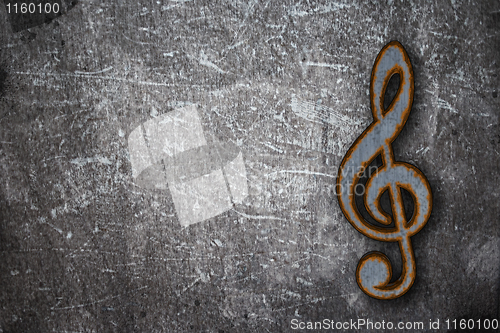 Image of rusty clef on grunge background