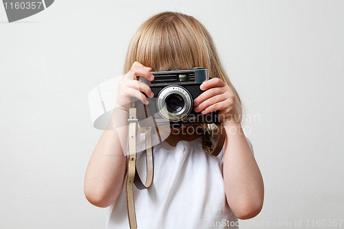 Image of Little girl with camera