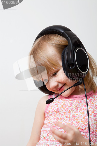 Image of Little girl with headphones