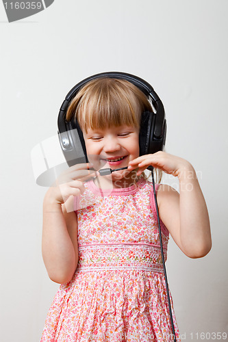 Image of Little girl with headphones