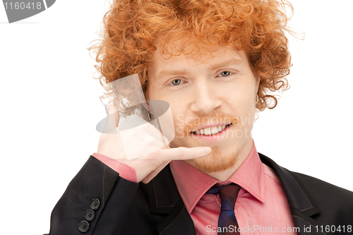 Image of man making a call me gesture
