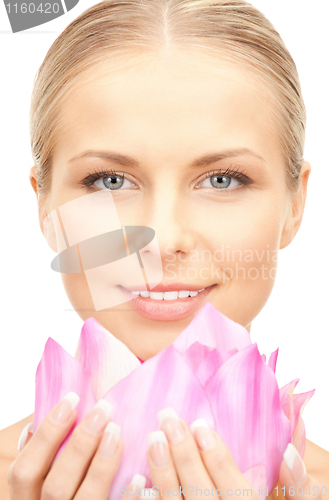 Image of beautiful woman with lotus flower