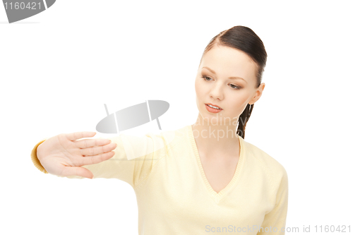 Image of businesswoman working with something imaginary