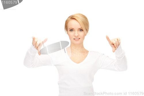 Image of businesswoman working with something imaginary