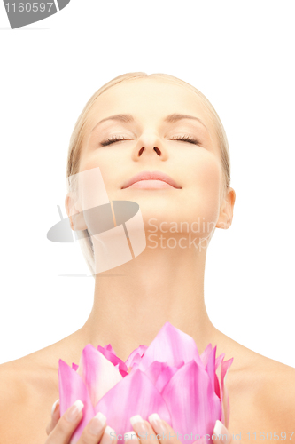 Image of beautiful woman with lotus flower