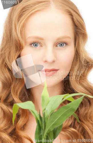 Image of woman with green sprout
