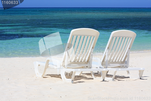 Image of Loungers facing the Caribbean Sea