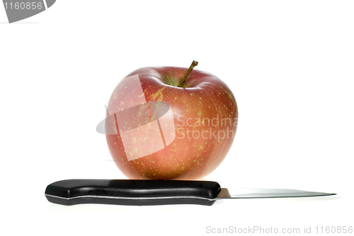 Image of Red apple and small steel knife