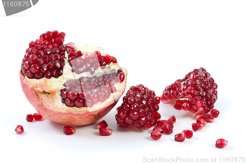 Image of Half of pomegranate, piece and some berries