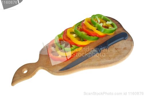 Image of Cutting board with knife and bell pepper slices