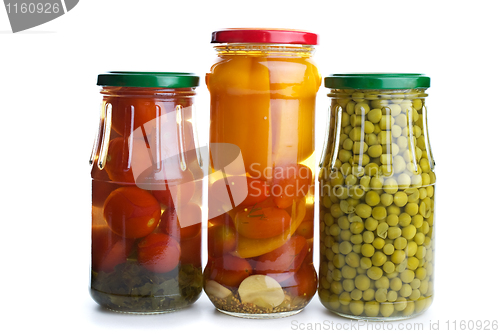 Image of Three glass jars with marinated vegetables