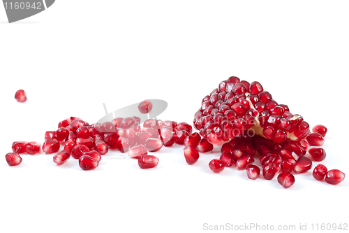 Image of Piece of pomegranate and some berries