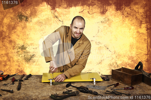 Image of carpenter at work grunge background