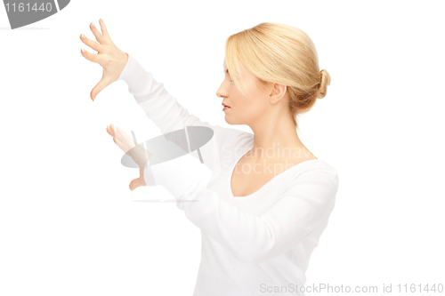 Image of businesswoman working with something imaginary