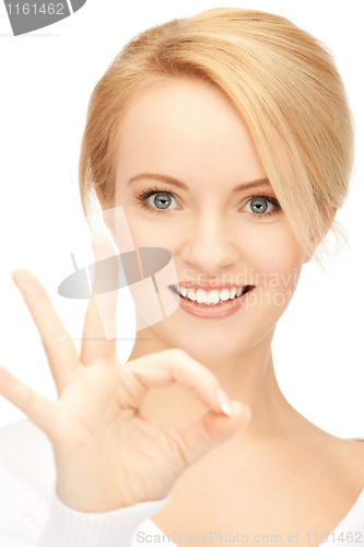 Image of lovely teenage girl showing ok sign