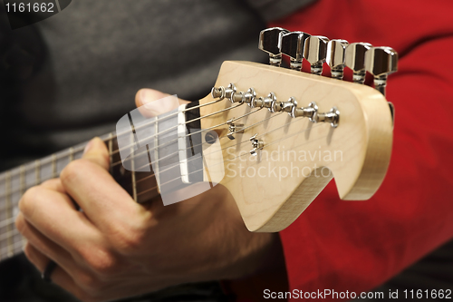 Image of detail of guitar