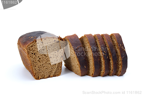Image of Chunk of rye bread with anise and some slices