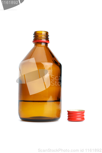 Image of Bottle with liquid and cap near