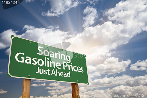 Image of Soaring Gasoline Prices Green Road Sign and Clouds