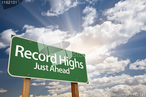 Image of Record Highs Green Road Sign and Clouds