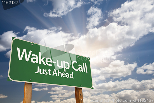 Image of Wake-up Call Green Road Sign and Clouds