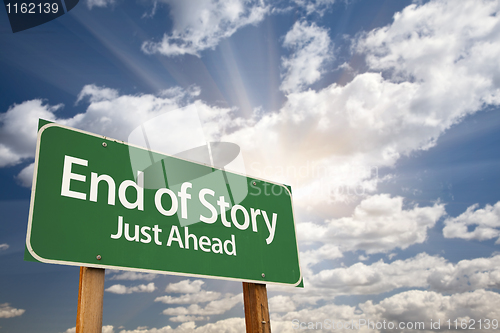 Image of End of Story Green Road Sign and Clouds