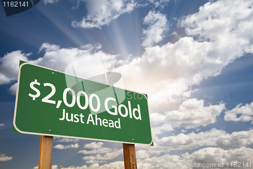 Image of $2,000 Gold Green Road Sign and Clouds