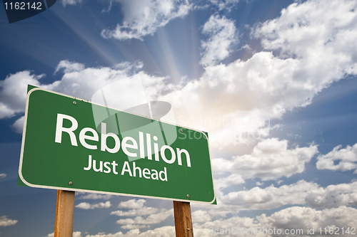 Image of Rebellion Green Road Sign and Clouds