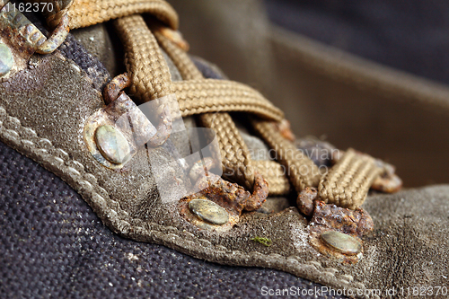 Image of old used trekking shoes