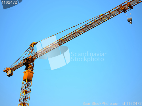 Image of crane and blue sky background