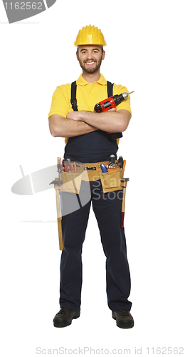 Image of young worker standing with red drill