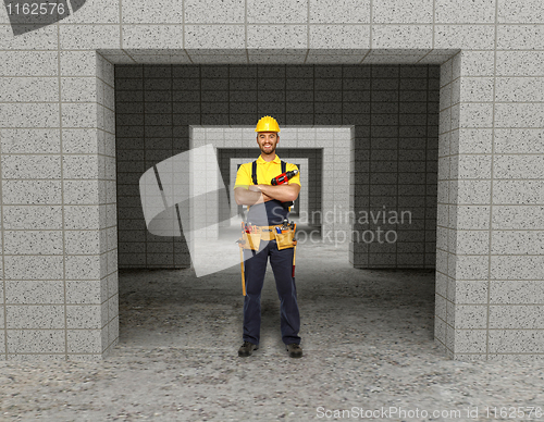 Image of manual worker in modern building