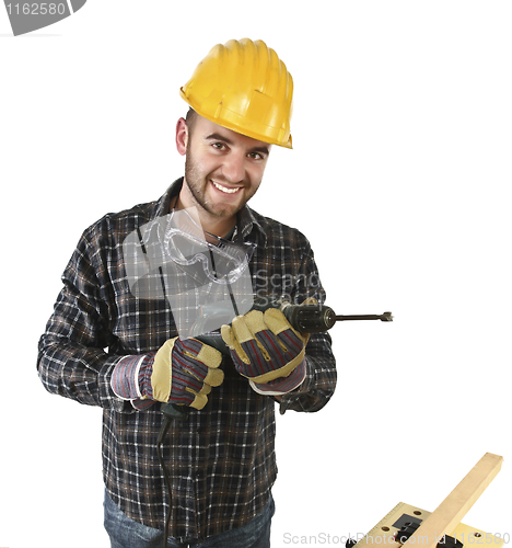 Image of isolated standing handyman with electric drill 