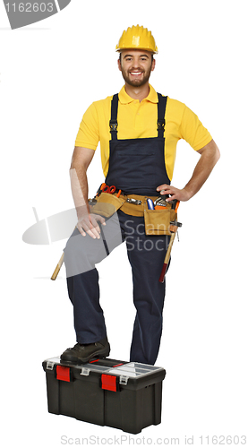 Image of young manual worker with toolbox