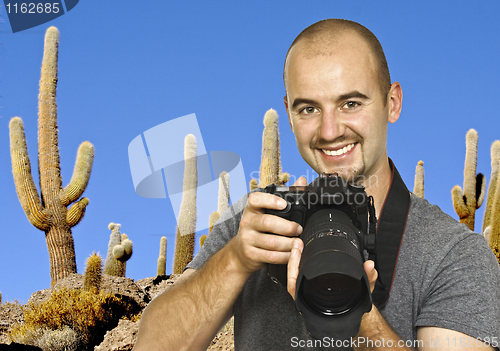 Image of photographer and cactus background