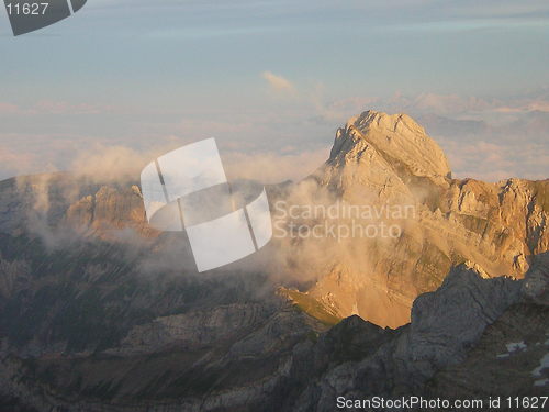 Image of cloudy mountain peak