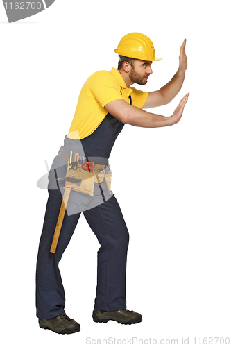 Image of handyman in push position suitable for composition