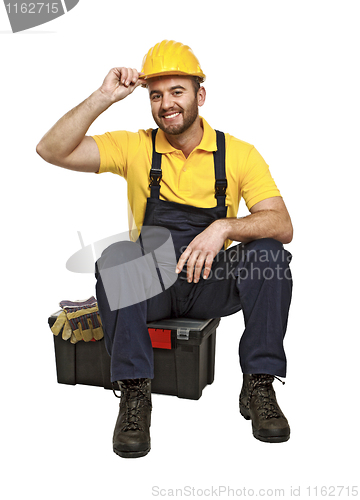 Image of handyman sit on his toolbox