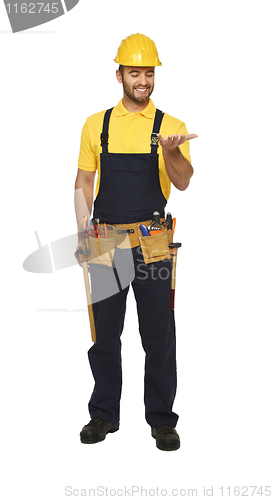 Image of happy handyman standing on white background