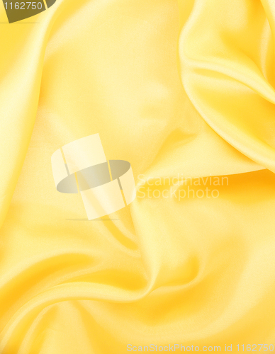 Image of Smooth elegant golden silk as background 