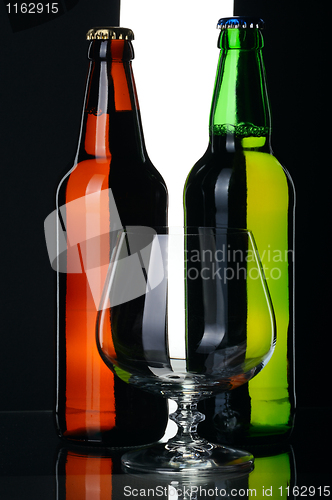 Image of Bottles of beer from green and brown glass, isolated.
